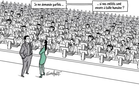D'interminables rangées de personnes travaillant sur des PC sans interactions